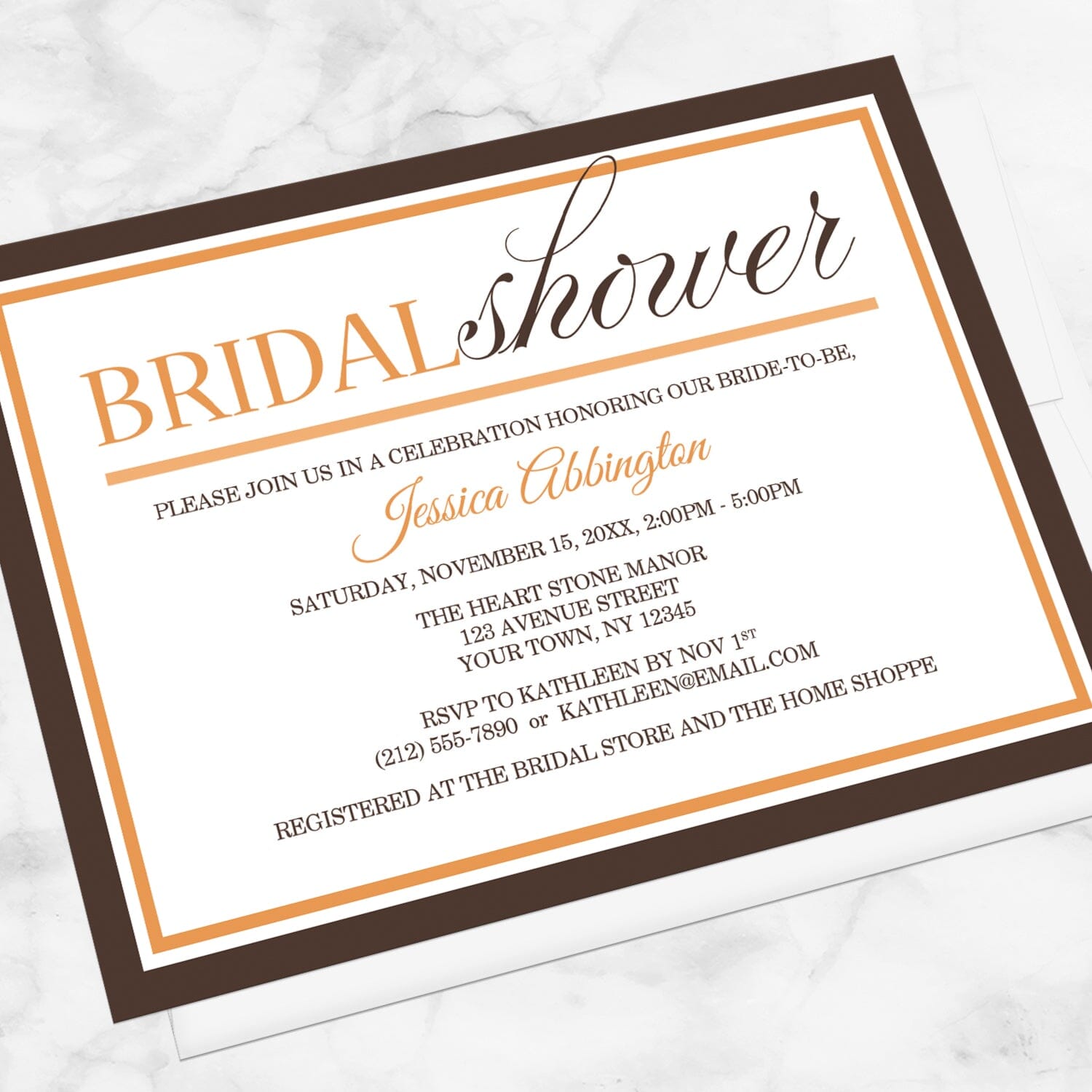 Modern Orange and Brown Autumn Bridal Shower Invitation shown at an angle on a marble surface with a white envelope.
