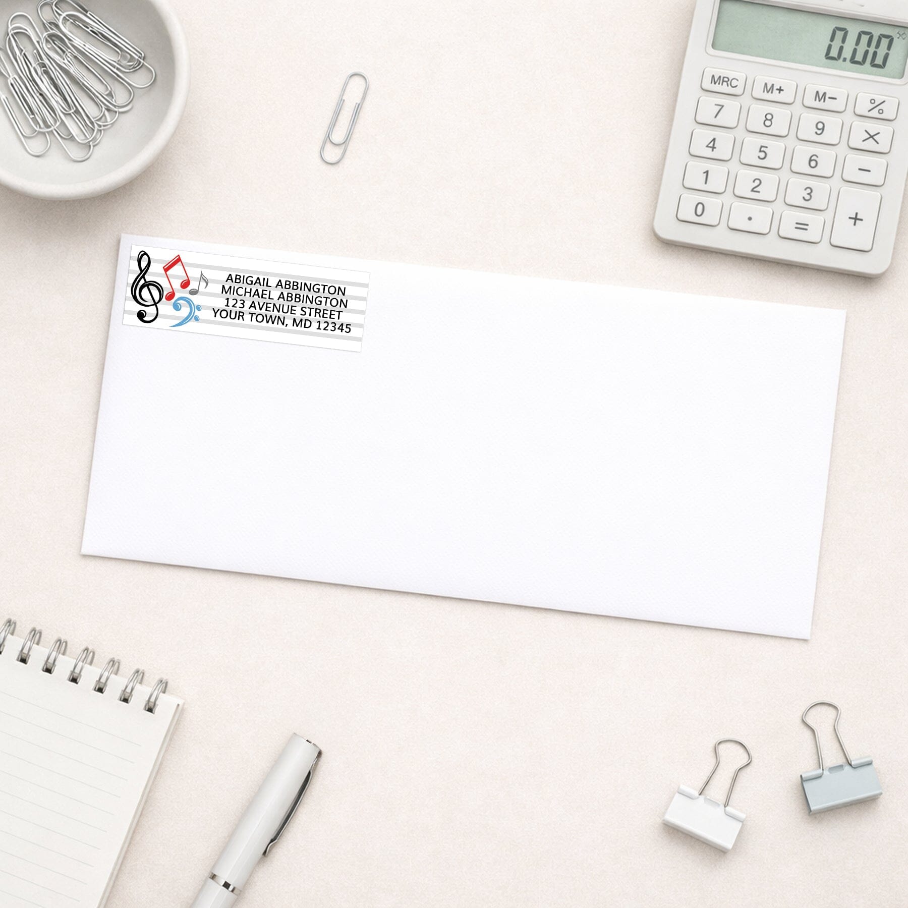 Music Notes Address Label shown on a white envelope with office supplies