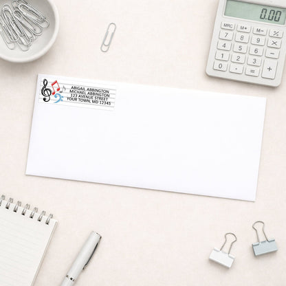 Music Notes Address Label shown on a white envelope with office supplies