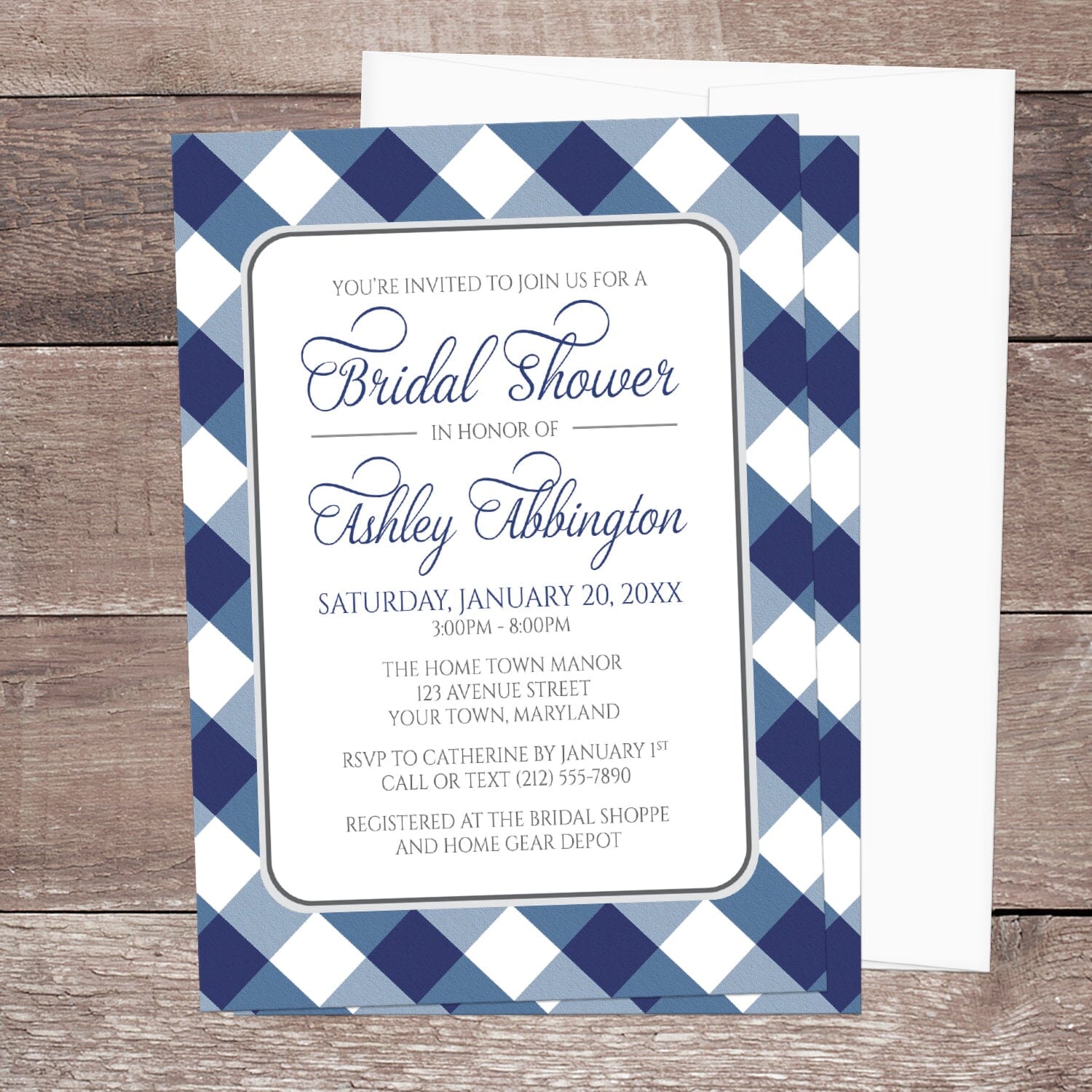 Navy Blue Gingham Bridal Shower Invitation with blue and white checkered border shown on a wooden surface with a white envelope.