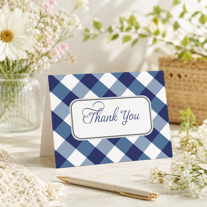 Navy Blue Gingham Thank You Card shown on a tabletop with a vase, spring and summer flowers, and a pen.