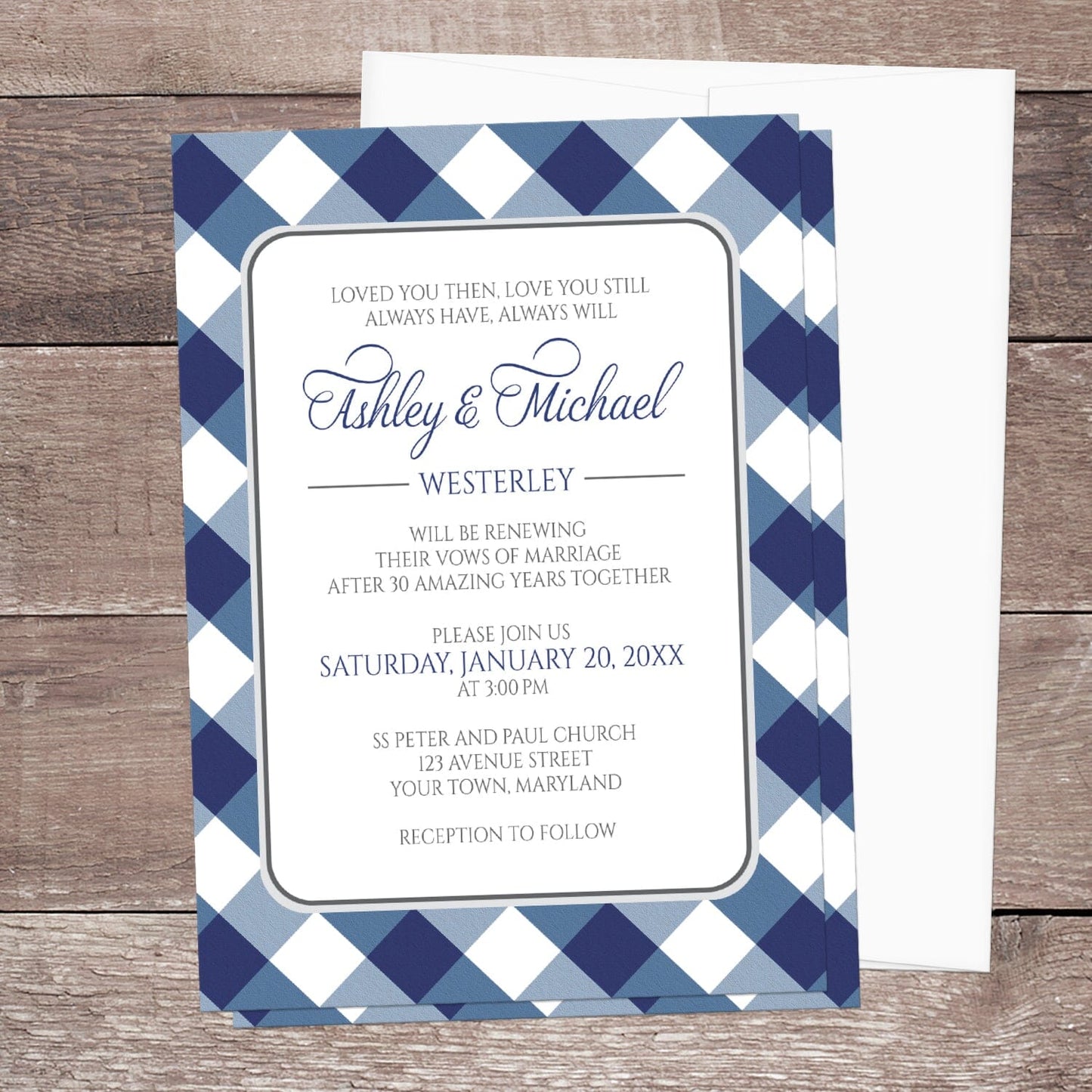 Navy Blue Gingham Vow Renewal Invitation shown on a brown wooden surface with a white envelope.