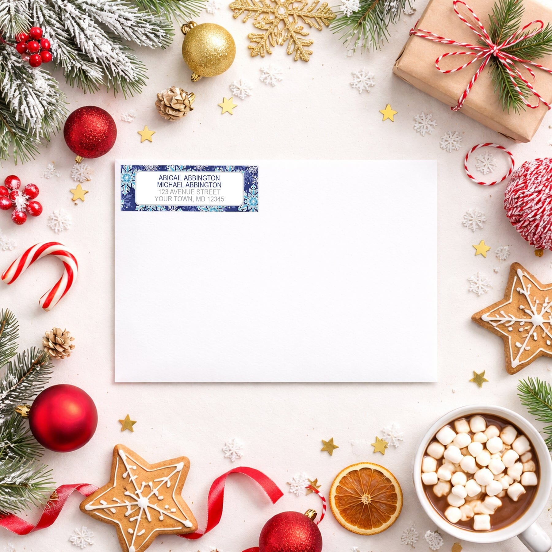 Navy Blue Snowflake Winter Return Address Label shown on a white envelope with Christmas holiday supplies
