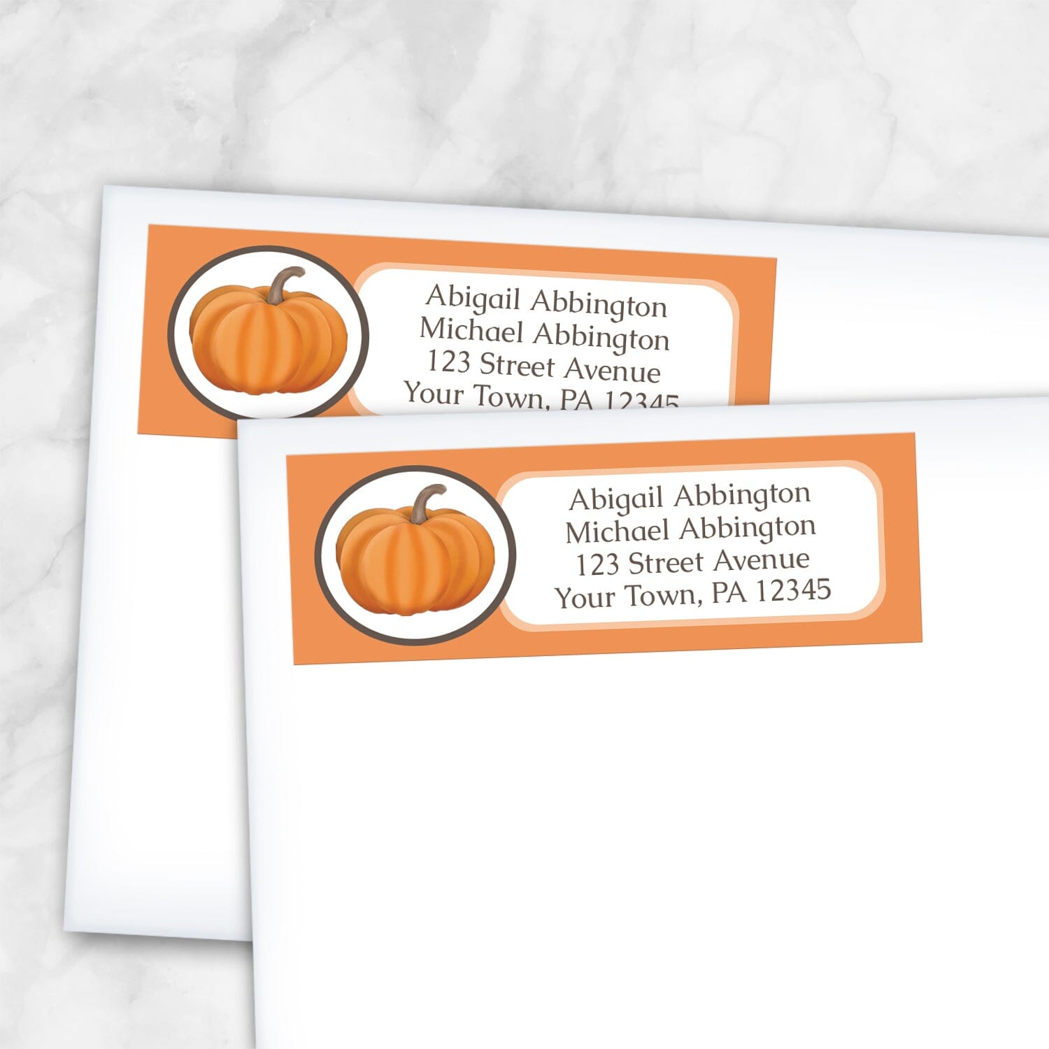 2 Orange Pumpkin Address Labels shown on white envelopes on a marble surface
