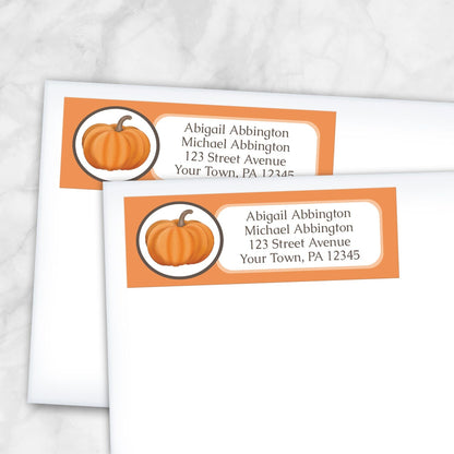 2 Orange Pumpkin Address Labels shown on white envelopes on a marble surface