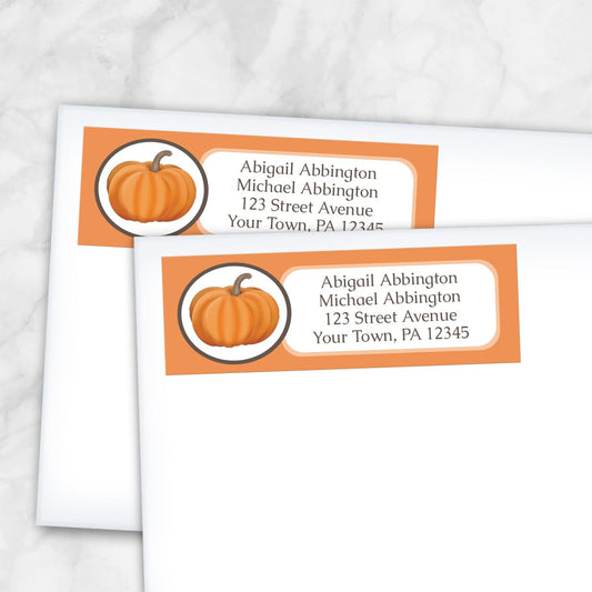 2 Orange Pumpkin Address Labels shown on white envelopes on a marble surface