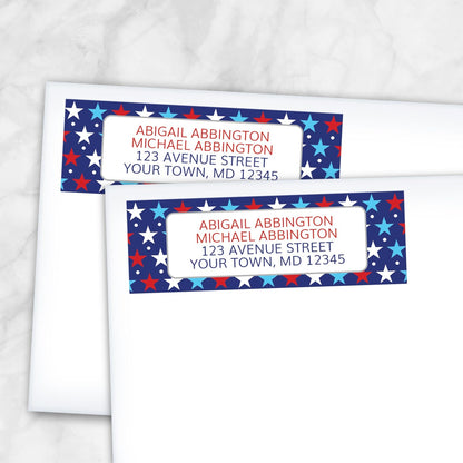 Patriotic Red White Blue Stars Address Labels shown on two white envelopes on a marble surface.