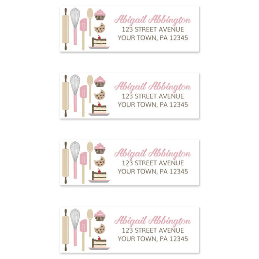 Pink Baking Address Labels at Artistically Invited. Image shows 4 labels. High-quality address labels designed with cute kitchen baking tools and baked treats in pink, brown, gray, and beige on the left side over a white background. Your personalized return address is custom printed in pink and brown to the right of the pink baking tools and baked goods design. These premium return address labels are great for bakers, pastry chefs, or anyone who loves baking.