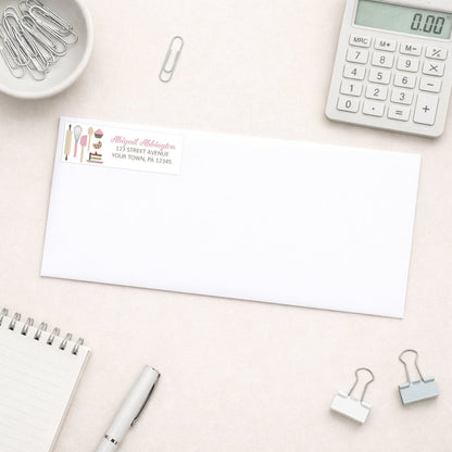Pink Baking Address Label shown on a white envelope with office supplies