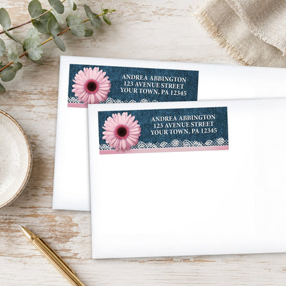 Pink Daisy Lace Rustic Denim Address Labels, shown on white envelopes, on a wooden surface with eucalyptus leaves and a pen.