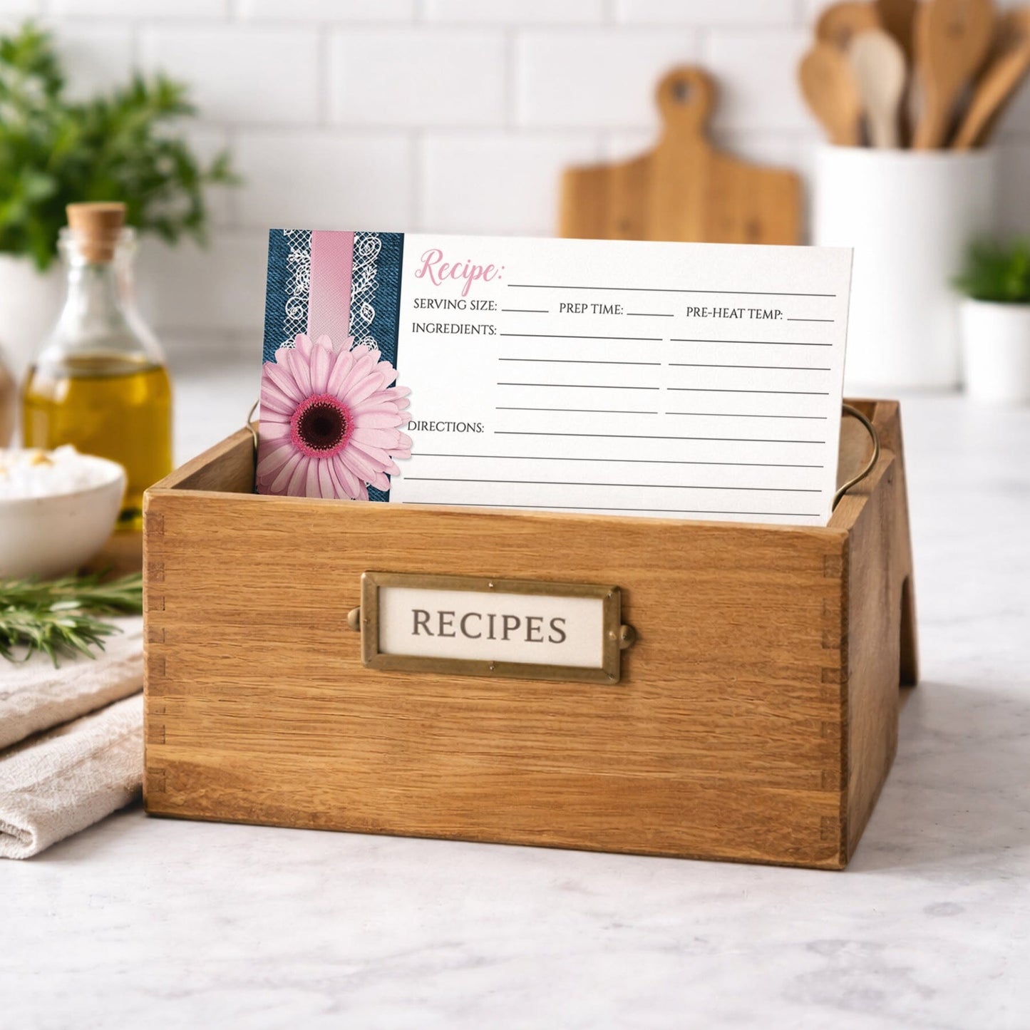 Wooden recipe box with a Pink Daisy Lace Rustic Denim Recipe Card on a kitchen counter