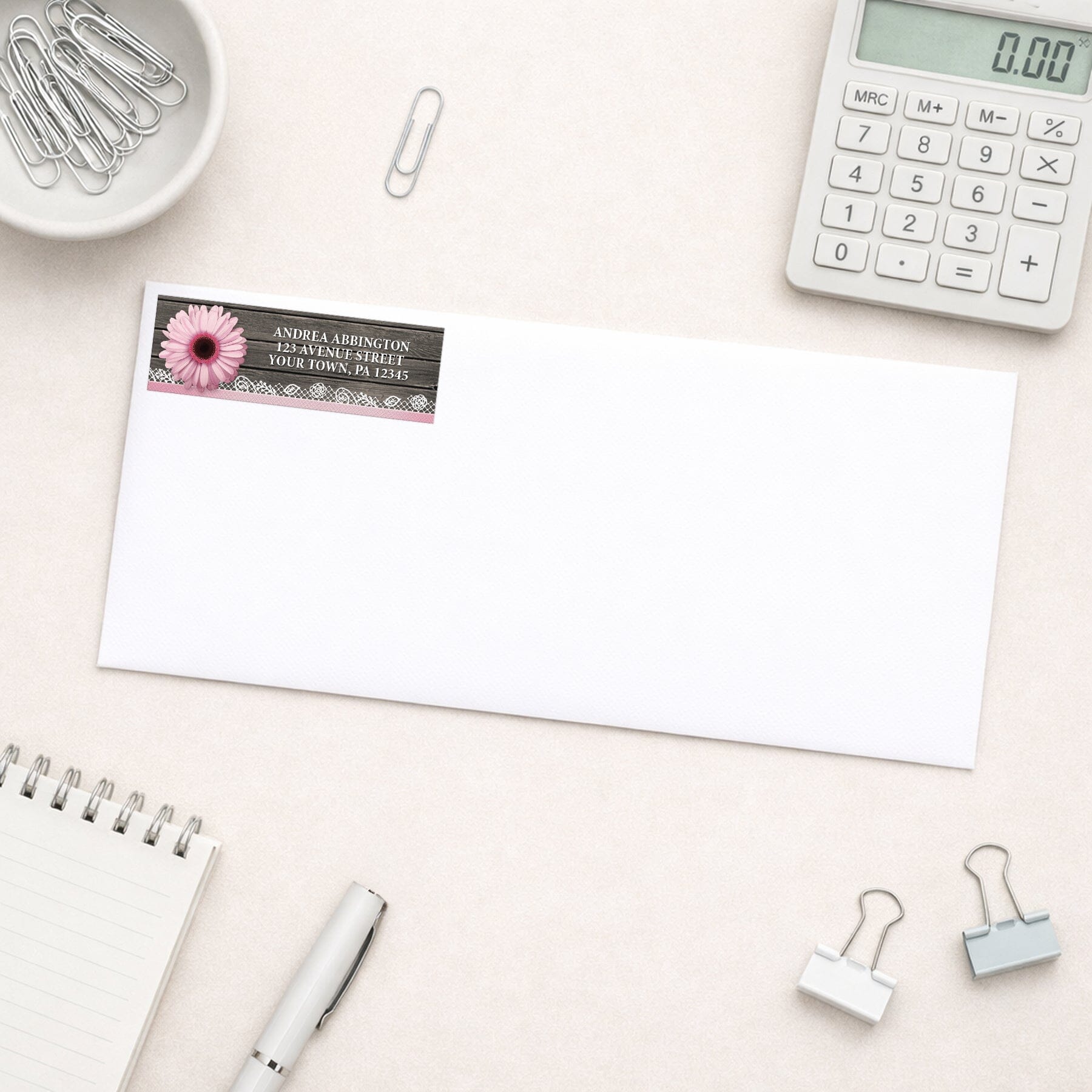 Pink Daisy Lace Rustic Wood Address Label shown on a white envelope with everyday office supplies