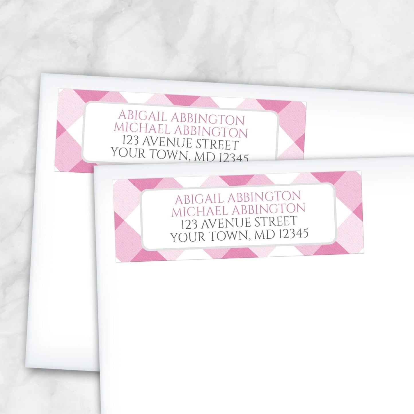 2 Pink Gingham Address Labels shown on white envelopes on a marble surface