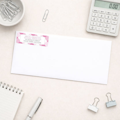 Pink Gingham Address Label shown on a white envelope with everyday office supplies
