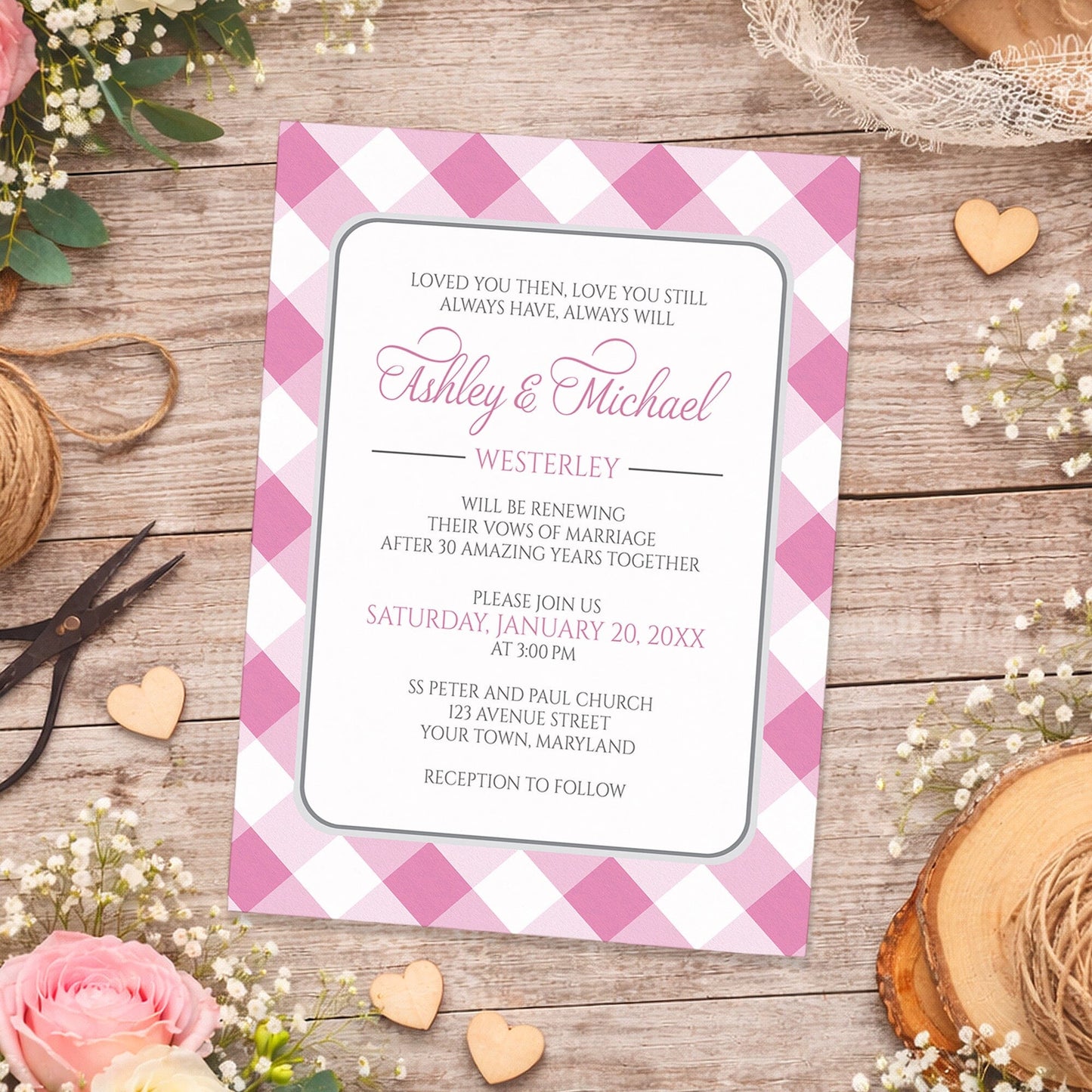 Pink Gingham Vow Renewal Invitation shown on a wooden surface with spring and summer flowers, small wood hearts, lace, and twine.
