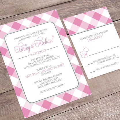 Pink Gingham Vow Renewal Invitation shown at an angle on a brown wood surface with the matching RSVP card.