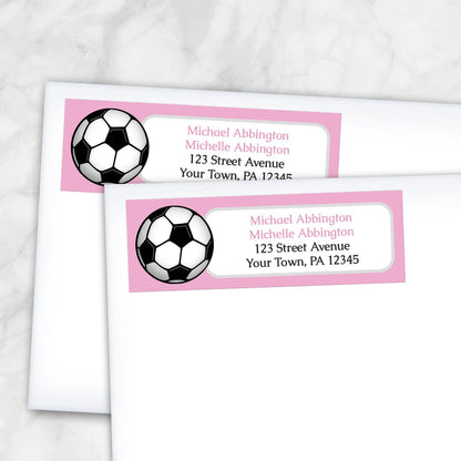 2 Pink Soccer Ball Return Address Labels shown on white envelopes on a marble surface