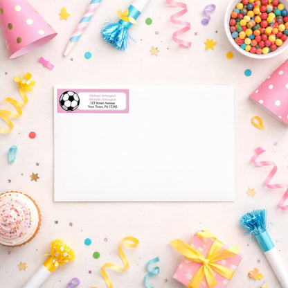 Pink Soccer Ball Return Address Label shown on a white envelope with party supplies