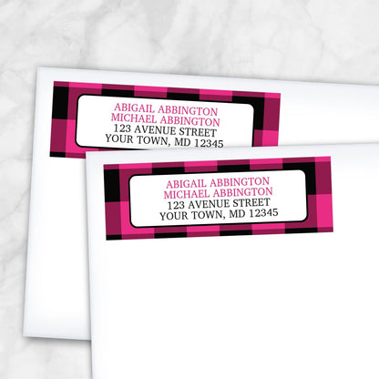 2 Pink and Black Buffalo Plaid Address Labels shown on white envelopes on a marble surface