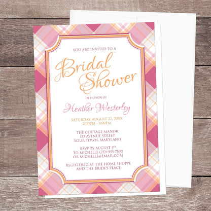 Pink and Orange Plaid Bridal Shower Invitation shown on a wood surface with a white envelope.