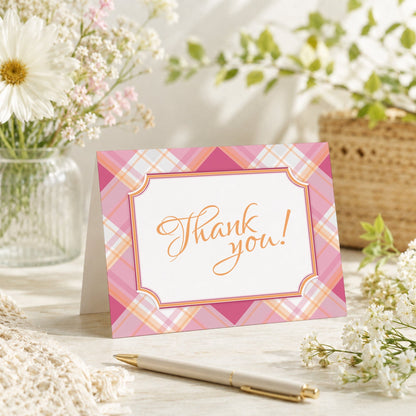 Pink and Orange Plaid Thank You Card shown on a tabletop with a vase, spring and summer flowers, and a pen.