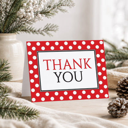 Polka Dot Red Black and White Thank You Card shown on a tabletop with a vase, winter greenery, and pine cones.