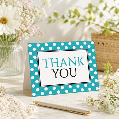 Polka Dot Turquoise Black and White Thank You Card shown on a tabletop with a vase, spring and summer flowers, and a pen.