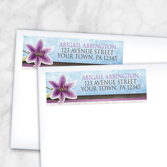 2 Pretty Floral Wood Purple Lily Address Labels shown on two white envelopes on a marble surface