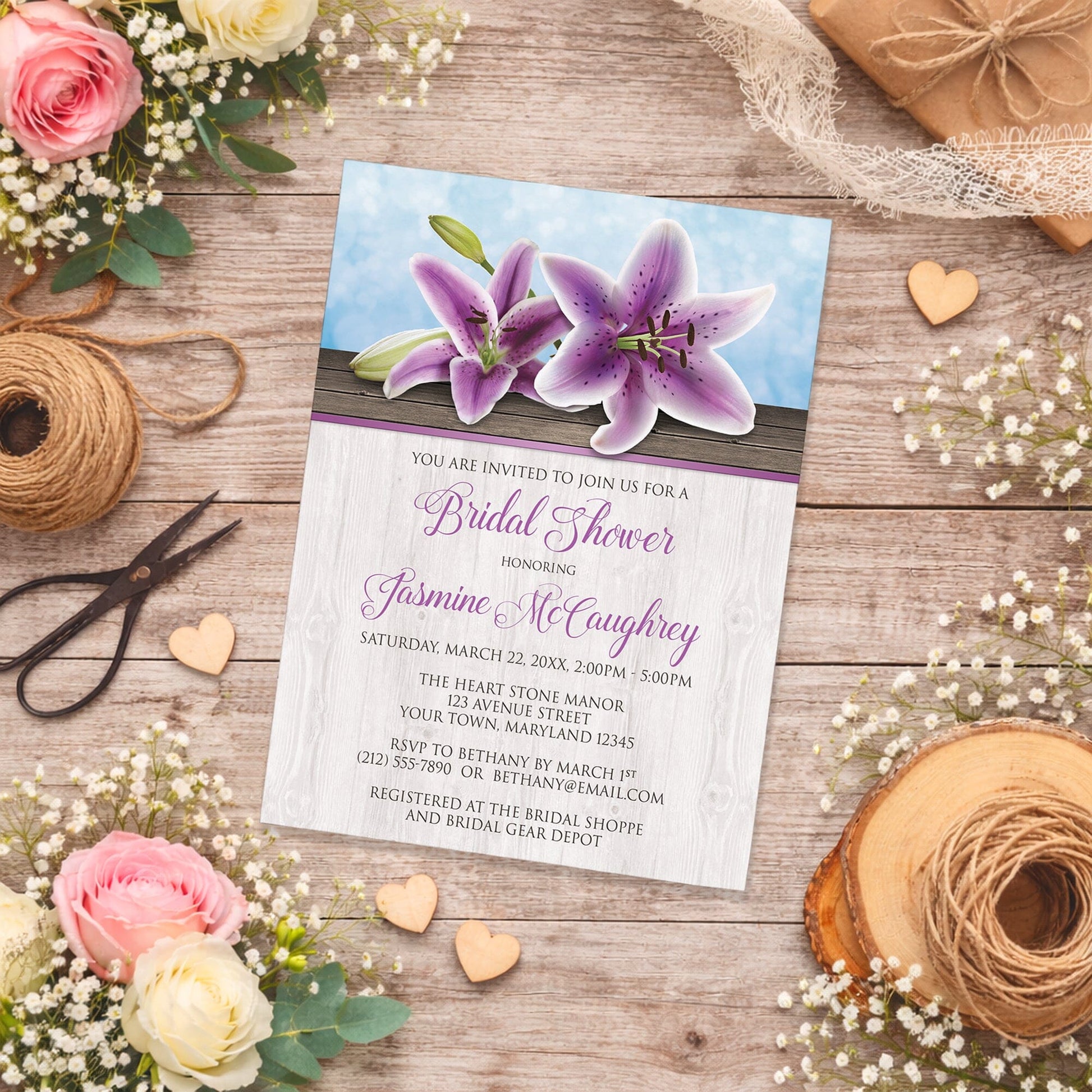 Pretty Floral Wood Purple Lily Bridal Shower Invitation on a wooden surface with flowers and twine.