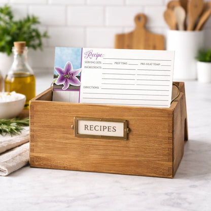 Wooden recipe box with a Pretty Floral Wood Purple Lily Recipe Card on a kitchen counter