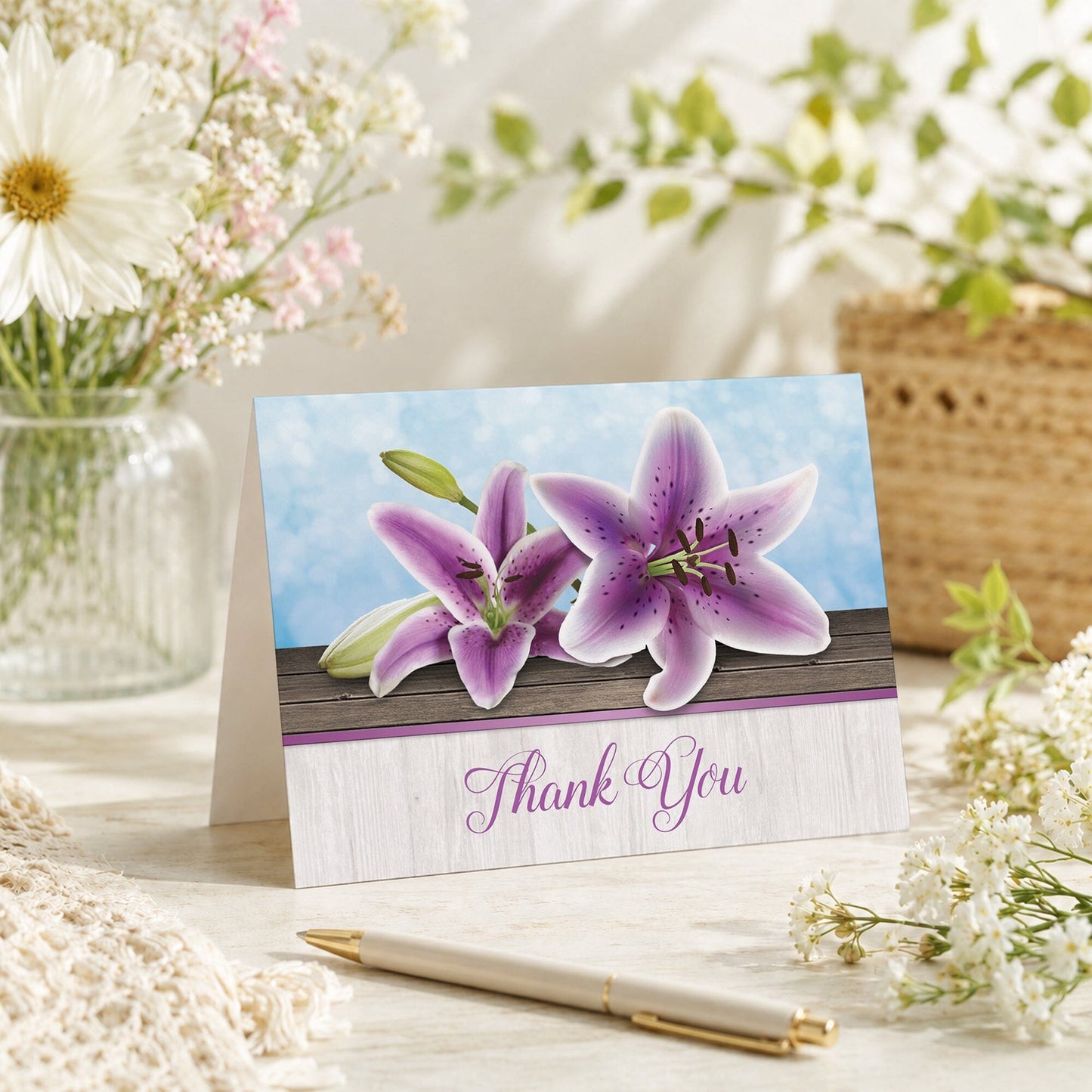 Pretty Floral Wood Purple Lily Thank You Card shown on a tabletop with a vase, spring and summer flowers, and a pen.