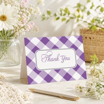 Purple Gingham Thank You Card shown on a tabletop with a vase, spring and summer flowers, and a pen.