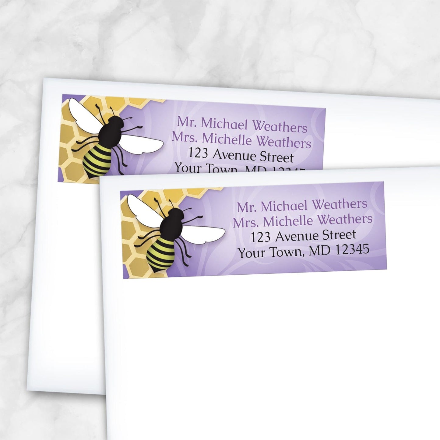 2 Purple Honeycomb Bee Address Labels shown on white envelopes on a marble surface