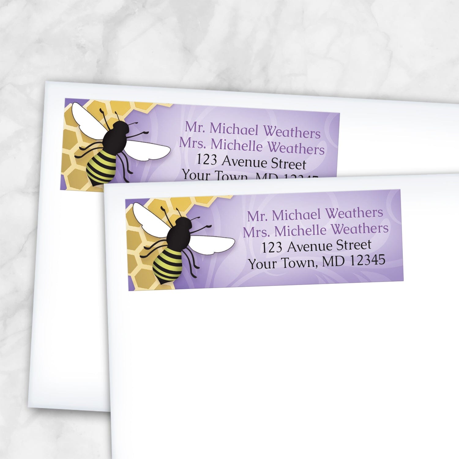 2 Purple Honeycomb Bee Address Labels shown on white envelopes on a marble surface