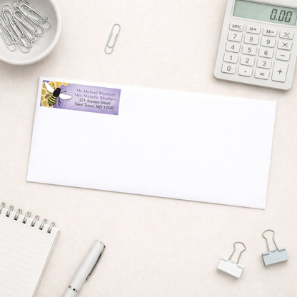 Purple Honeycomb Bee Address Label shown on a white envelope with everyday office supplies