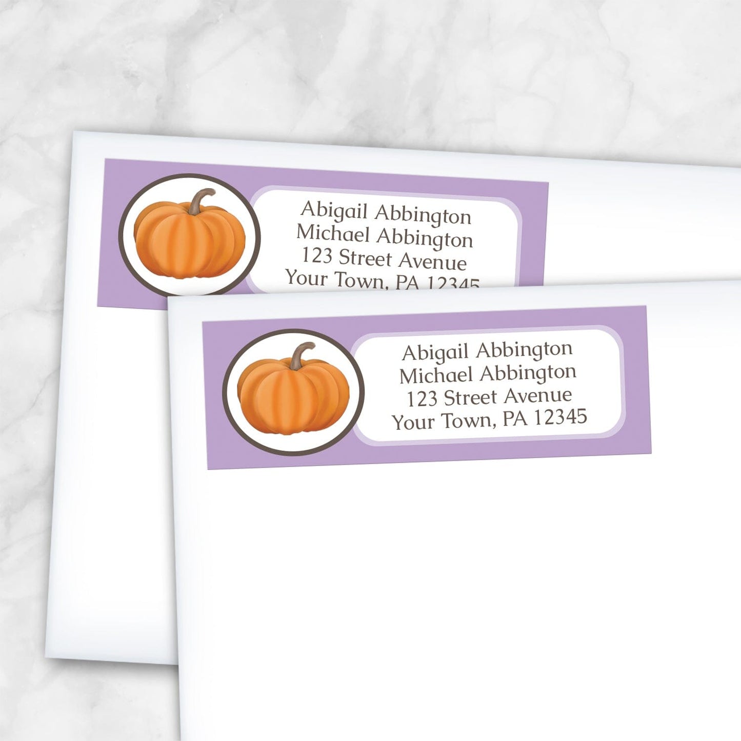 2 Purple Pumpkin Address Labels shown on white envelopes on a marble surface