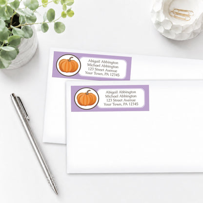Purple Pumpkin Address Labels shown on white envelopes, on a white surface with a plant and a pen.