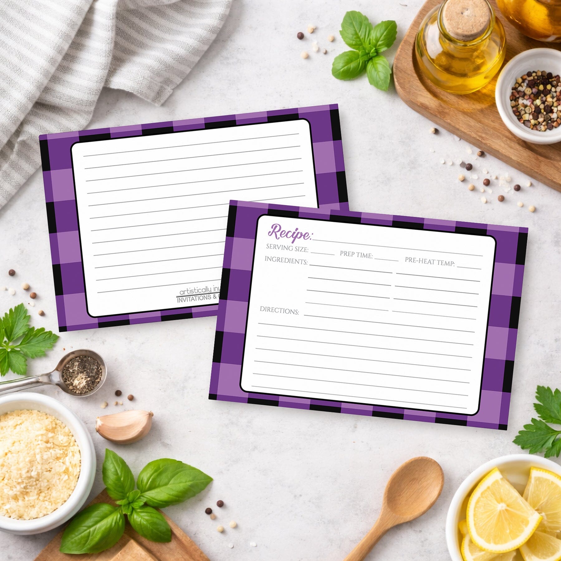 Two Purple and Black Buffalo Plaid Recipe Cards with purple checkered borders on a kitchen counter with ingredients.
