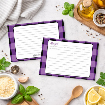 Two Purple and Black Buffalo Plaid Recipe Cards with purple checkered borders on a kitchen counter with ingredients.