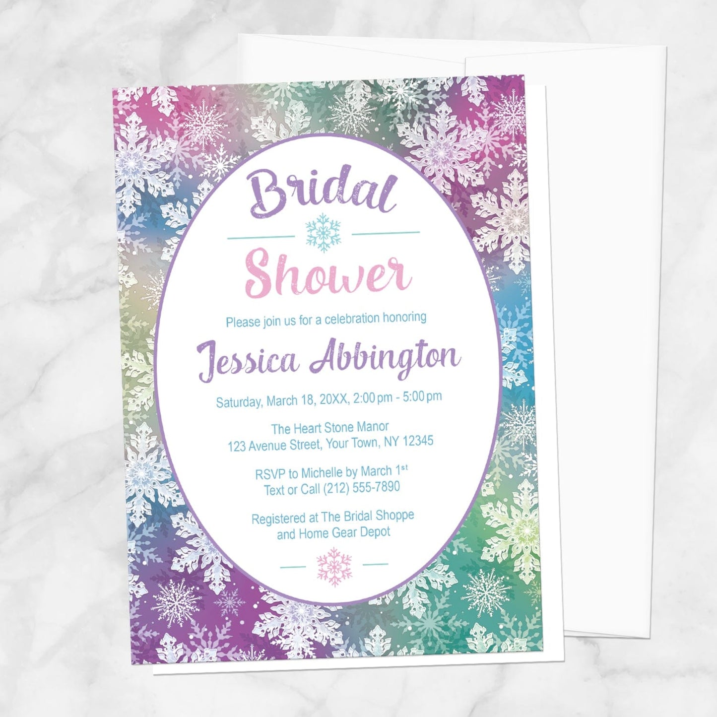 Rainbow Snowflake Bridal Shower Invitation shown on a marble surface with a white envelope.