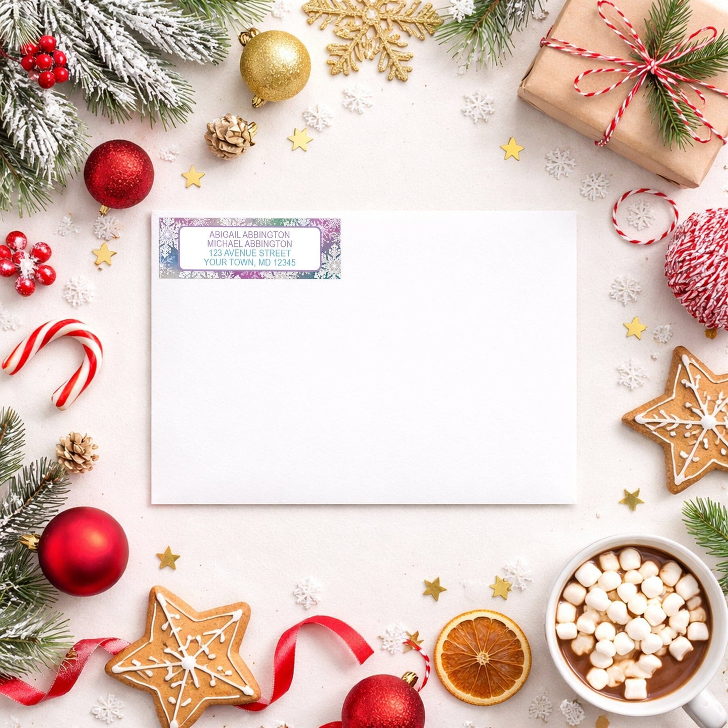 Rainbow Snowflake Winter Return Address Label shown on a white envelope with Christmas holiday supplies