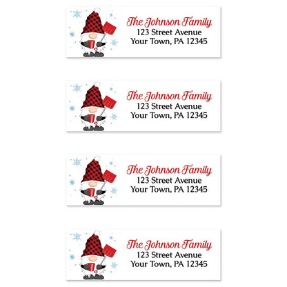 Red Buffalo Plaid Gnome Address Labels at Artistically Invited. Sheet of 4 labels. These address labels are designed with an illustration of a cute gnome wearing a red buffalo plaid hat while holding a red snow shovel and a hot beverage with snowflakes around him. Your personalized return address is custom printed in red and black over white to the right of the winter-themed gnome.
