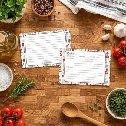 Two Red Baking Pattern Recipe Cards on a wooden surface with Italian kitchen ingredients.