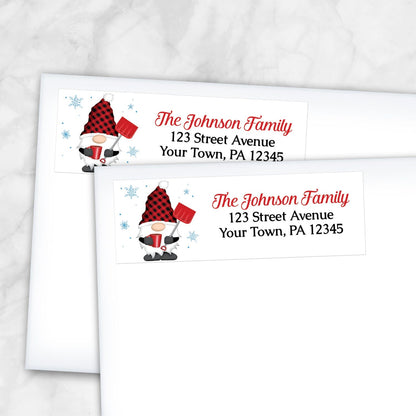 2 Red Buffalo Plaid Gnome Address Labels shown on white envelopes on a marble surface