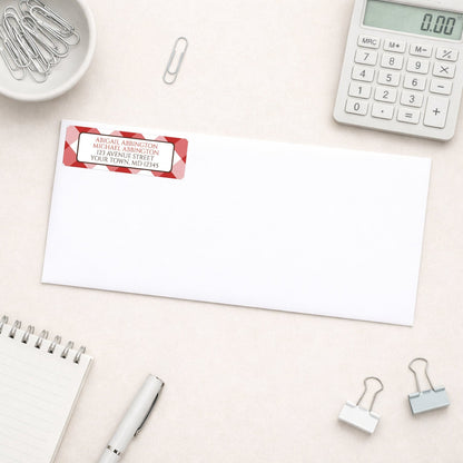 Red Gingham Address Label shown on a white envelope with everyday office supplies