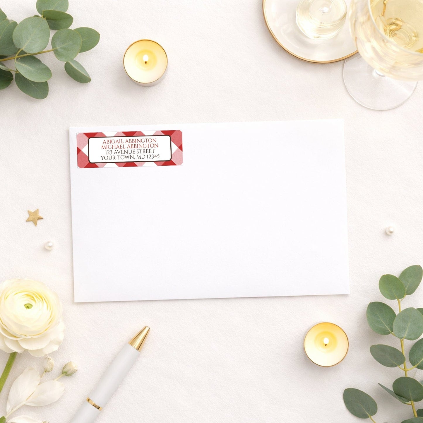 Red Gingham Address Label shown on a white envelope with wedding and shower supplies