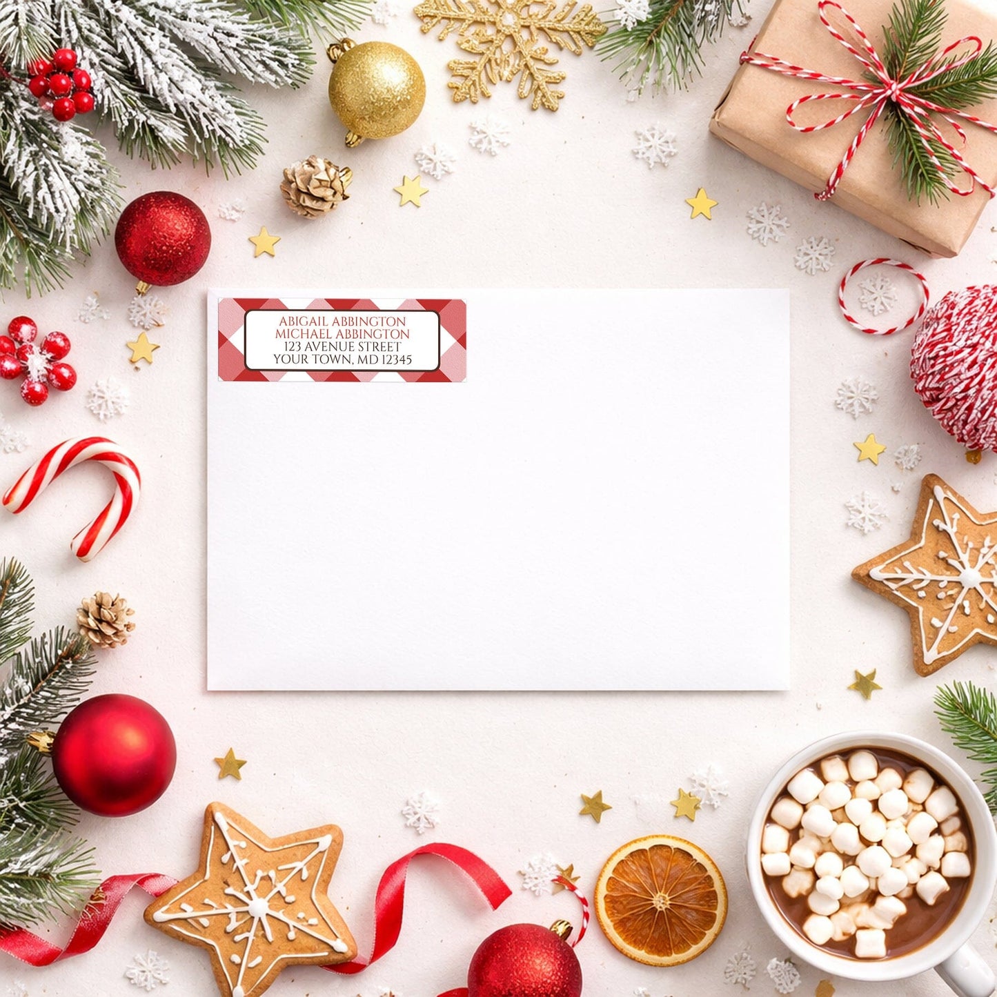 Red Gingham Address Label shown on a white envelope with winter Christmas holiday supplies
