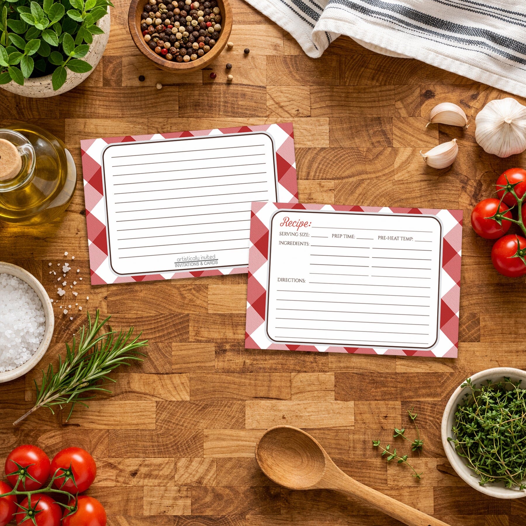 Two Red Gingham Recipe Cards on a wooden surface with Italian cooking ingredients.