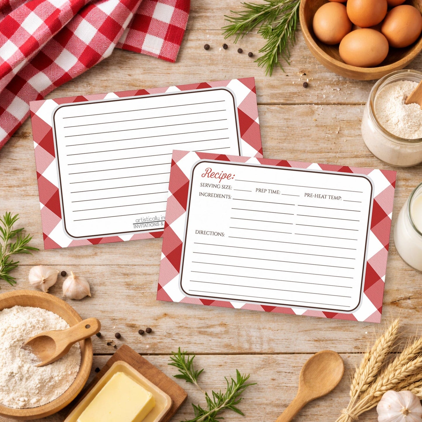 Two Red Gingham Recipe Cards on a country wooden surface with cooking ingredients.