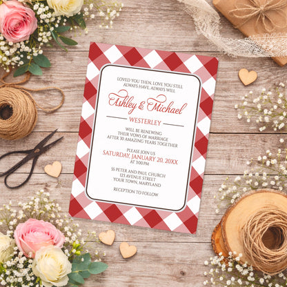 Red Gingham Vow Renewal Invitation shown on a wooden surface with spring and summer flowers, small wood hearts, and twine.